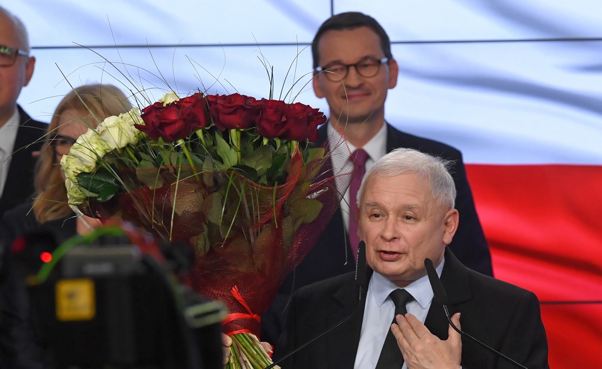 PiS leader Jarosław Kaczyński (front) and PM Mateusz Morawiecki (back) celebrate on Sunday.